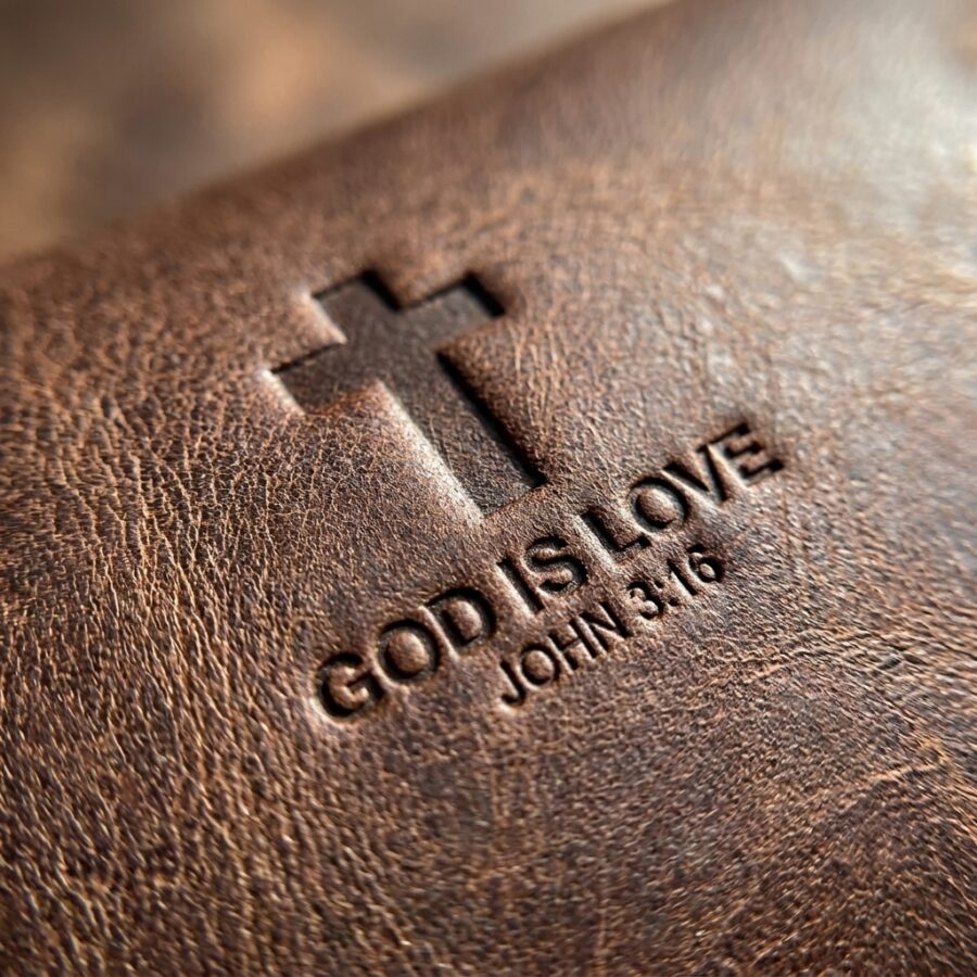 CGU-EYE-BROWN full-grain leather texture and debossed verse close-up