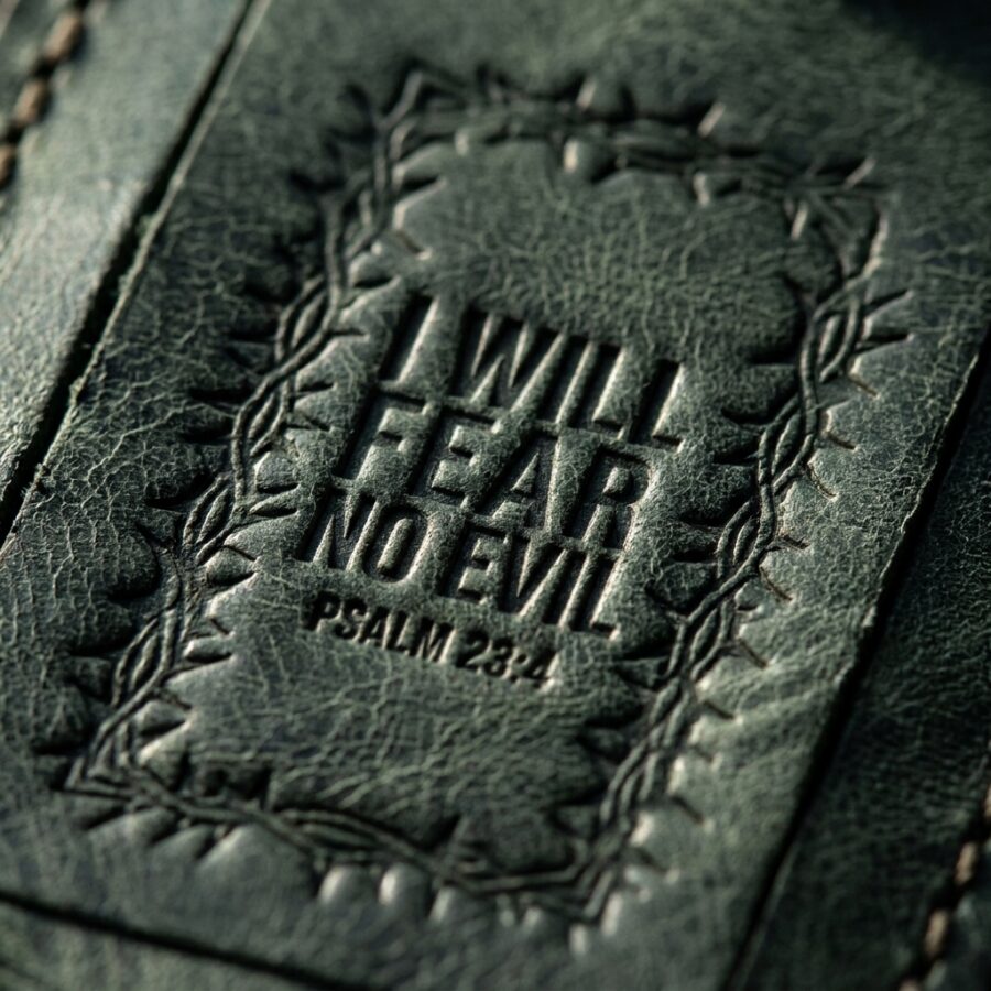 CGU-LUG-GREEN full-grain leather texture and debossed verse close-up