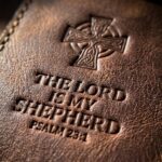 CGU-PEN-BROWN full-grain leather texture and debossed verse close-up