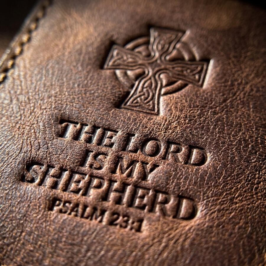 CGU-PEN-BROWN full-grain leather texture and debossed verse close-up