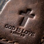 CGU-SCR-BROWN full-grain leather texture and debossed verse close-up