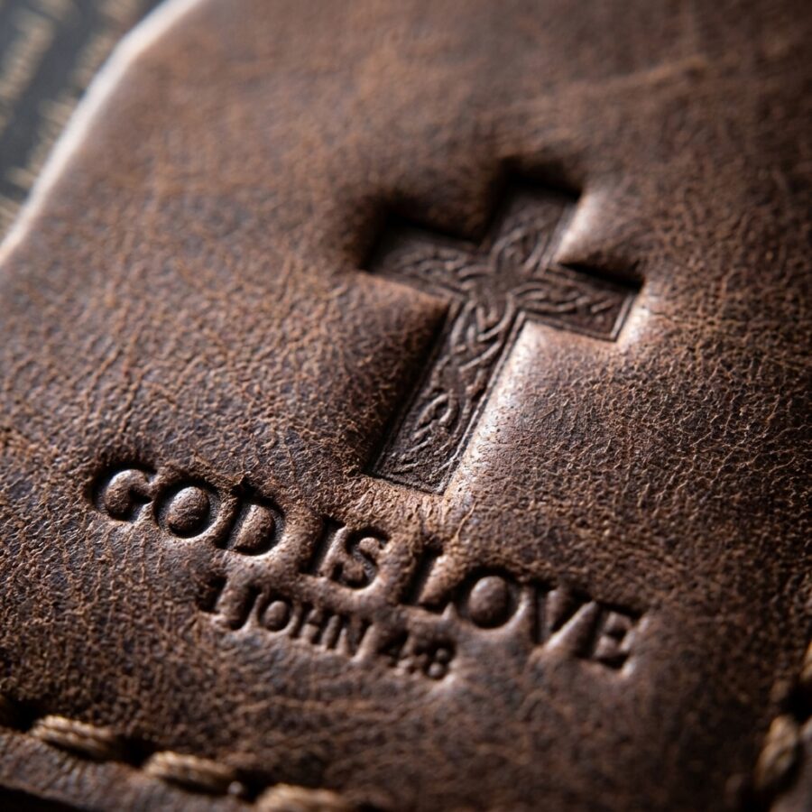 CGU-SCR-BROWN full-grain leather texture and debossed verse close-up